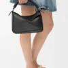 Borsa Puzzle piccola in pelle di vitello liscia e pelle di agnello nappa
