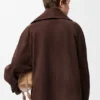 Giacca con fiocco in pelle di capra scamosciata