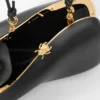 Minaudière intrecciata in pelle di agnello nappa