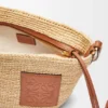 Pochette con spacco in rafia e pelle di vitello