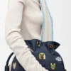 Pochette Flamenco media con gatti in denim ricamato