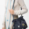 Pochette Flamenco media con gatti in denim ricamato