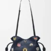 Pochette Flamenco media con gatti in denim ricamato